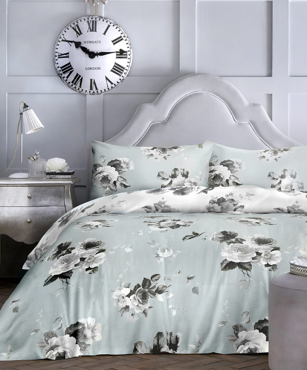 Bedding on a silver bedframe.