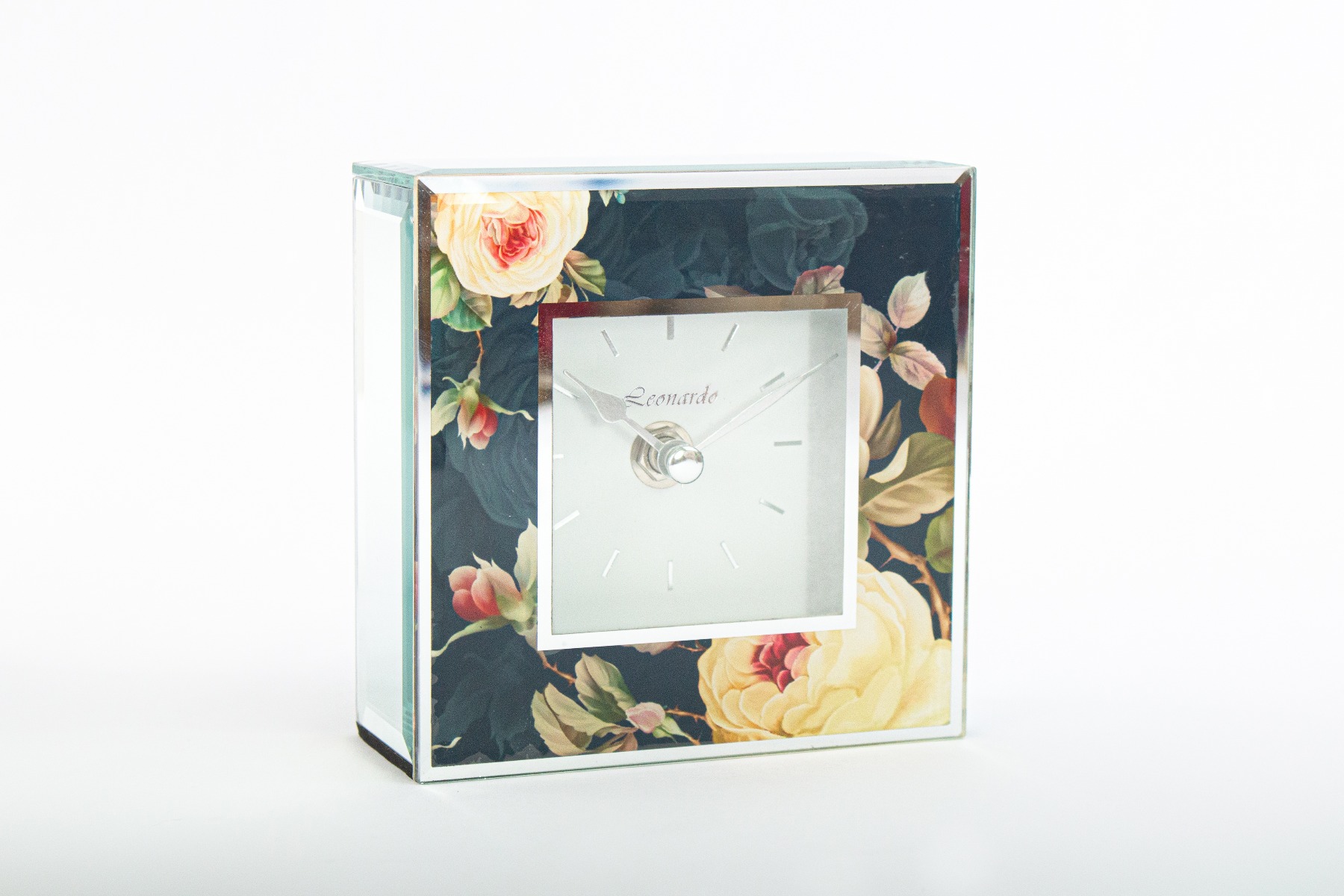 A clock with a floral design.